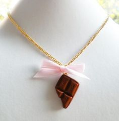 "Cute chocolate bar and pink ribbon necklace. This sweet piece of candy is made of strong polymer clay. ♥ 100% Handmade with polymer clay ♥ Comes on a 18\" gold-plated necklace ♥ Always gift wrapped ♥ ♥ Check out my other items: BabyLovesPink.etsy.com Follow Baby Loves Pink on: Instagram @babylovespink Facebook.com/babylovespink Thank you for visiting Baby Loves Pink! © Baby Loves Pink" Sweet Gold Necklace For Gift, Sweet Gold Necklace Perfect For Gift, Sweet Gold Necklace As Gift, Pink Polymer Clay Necklace For Gift, Pink Polymer Clay Necklace For Gifts, Matching Necklaces For Couples, Cute Chocolate, Photo Locket Necklace, Ribbon Necklace