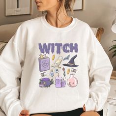 PLEASE NOTE, DUE TO THE BUSY HOLIDAY SEASON ANY ORDERS PLACED AFTER 12/09/24 ARE NOT GUARANTEED TO ARRIVE BY CHRISTMAS.Represent your Witchy side with this trendy Witch doodle sweatshirt.  Comes in multiple colors! ❤️ Please note that for the oversized look you need to buy 1-3 sizes larger than you normally wear. If you prefer the standard Unisex fit order your typical size. For women, if you prefer a more women's fit sweatshirt please size down 1 size, as this sweatshirt is a Unisex fit ❤️ This Trendy Crewneck Sweatshirt, Doodle Shirt, Trendy Crewneck, Witch Sweatshirt, Skull Sweatshirt, Sweatshirt Halloween, Halloween Sweatshirt, Fall Sweatshirt, Workout Sweatshirt