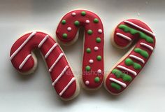 two decorated cookies in the shape of letters