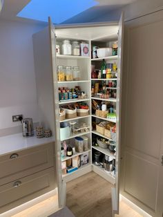 an open pantry with lots of food in it