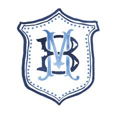 a blue and white monogramed shield with the letter b in it's center