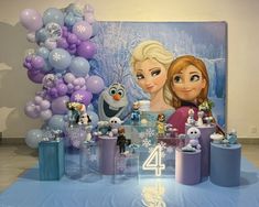 a frozen princess birthday party with balloons and decorations