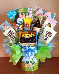 a gift basket filled with candy, candies and other things to make him smile