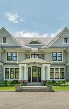 a large white house with lots of windows