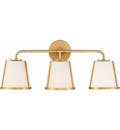 three light bathroom fixture with white shades on the top and gold trimming, in an antique