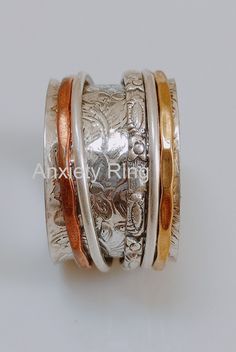 Silver Spinning Ring, Meditation Spinner Ring, Spin Ring, Fidget Ring, Copper Brass Ring, Anxiety Ring, Worry Ring,  Flower Ring -----FREE SHIPPING OFFER------ A NAME OF TRUST Anxiety Ring Spinner Ring, 925 Sterling Silver Three Tone Ring, Fidget Spinner Ring, Worry Ring, Meditation Ring, Ring for Women Gift Ideas We Always Believe In Customer Satisfaction, Your Feedback Is Very Important & Valuable For A Successful Organisation, So Please Drop A Feedback If You Are Liking Or Disliking Our Product. OR What Changes We Should Do In Our Bulk Collection Of Jewelry. Your Advise Is Very Precious For Us. Thank You So Much For Giving Your Precious Time To My Firm Our products are totally handmade and made with high quality gemstones and sterling silver. PLEASE GIVE ME A CHANCE ! Have a Nice Day ! Fidget Rings Jewelry, Spin Ring, Fidget Jewelry, Prayer Ring, Spinning Ring, Meditation Ring, Spinning Rings, Worry Ring, Unusual Rings