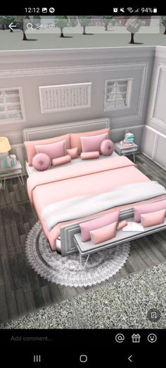 a bed with pink and white pillows in a room