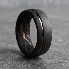 The Monaco Black and Gold Carbon Fiber Wedding Ring Men’s Wedding Bands With Wood, Carbon Fiber Rings For Men, Mens Black Engagement Rings, Black His And Hers Wedding Rings, Me S Wedding Band, Meteorite Mens Wedding Ring, Black Mens Engagement Ring, Mens Black Rings, Men’s Wedding Rings Simple