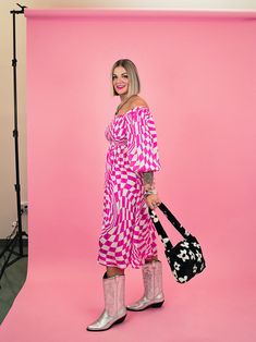 Unleash your inner punk rock princess in this flirty and fun Punk Rock Princess Checkered Midi Dress! Perfect for summer, it's flowy and breezy while still retaining an edgy, feminine vibe. Channel your rebellious spirit with this must-have addition to your wardrobe! -All over wavy, pink + white checkered pattern! -Stretchy, smocked fitted bust -Square neckline -Puff sleeves -- so cute! -Midi length -NO see through! -100% Rayon -Full length: 44" SIZING: The dress fits true to size. Alora is 5'8 Pink Barbiecore Summer Dress, Trendy Pink Beach Midi Dress, Trendy Pink Midi Beach Dress, Edgy Summer Midi Dress, Trendy Pink Midi Dress For Beach, Trendy Pink Midi Dress For Day Out, Flirty Pink Midi Dress For Day Out, Trendy Pink Flowy Dress, Pink Retro Midi Dress