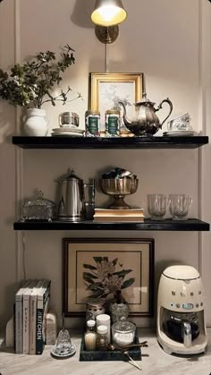 the shelves in this room are filled with coffee and tea pots, cups, and other items