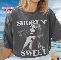 a woman wearing a shirt that says short n'sweet