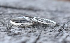 Ouroboros Snake Ring details:-Solid .925 sterling silver-Snake band measures approx. 2mm wide, 3mm wide at snake head.-Comfortable and easily stackable!-Lightly oxidized-Set of three including 3mm boho floral and 1.2mm bead available in the drop down menu. Connect with us on Instagram @a_wild_violet for sales and giveaways!**All items are in stock and ship within 2-5 business days from received payment (excluding Saturday/Sunday) from the US. If you are within the US please expect 3-7 business d Elegant Silver Engraved Snake Ring, Elegant Engraved Silver Snake Ring, Elegant Engraved Snake Ring For Anniversary, Handmade Sterling Silver Snake Ring For Wedding, White Gold Sterling Silver Snake Ring For Wedding, Adjustable Sterling Silver Snake Ring For Weddings, Ouroboros Jewelry, Ouroboros Snake, Silver Snake Ring