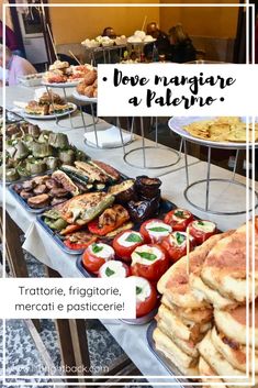 a table filled with lots of different types of food on top of each other in front of a sign that says love magiare a paleno