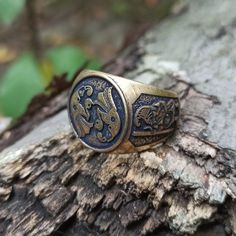 The custom signet rings are made to order from Italian bronze, silver plated bronze or silver 925 solid. The ring based on ancient artifacts with image of Odin's Ravens and image of warrior found on armour plates. This ring will be perfect for men and women who likes Norse mythology, Viking jewelry or Scandinavian Pagan aesthetics. The ring shipped in wooden jewelry gift box. approximate weight: 19 gm | 0.67 oz Crow Ring, Norse Raven, Raven Ring, Viking Artifacts, Odin's Ravens, Custom Signet Ring, Magic Items, Boys Jewelry, Jewelry Men