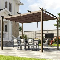 an outdoor dining area with patio furniture and grill