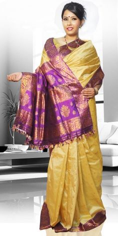 Beautiful Golden Colour Pat Guna Contrast Assam Silk Saree with artistic Guna work giving an unique look to the collection. This saree can be used as both wedding and festival Saree.The Saree comes with matching blouse piece, the blouse shown in the image is just for display purpose.Slight colour variation may be there in display & actual. Golden Color