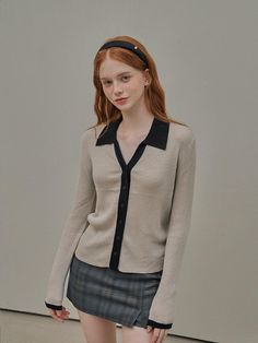 This versatile knit cardigan with two-tone collared design offers a clean design suitable for various outfits. It has essential color combinations for easy matching.- Cropped length that makes your look stylish- Slim fit that makes your body curves accentuated- Can be styled as both a cardigan or a top* Actual product color may vary according to the monitor settings and mobile device. Chic Beige Polo Sweater For Work, Classic Beige Collared Cardigan, Classic Collared Beige Cardigan, Elegant Beige Collared Polo Sweater, Classic Office Cardigan With Lapel Collar, Trendy Fitted Polo Sweater For Work, Elegant Collared Cardigan For Layering, Chic Collared Sweater With Seamless Collar, Winter Polo Sweater With Collared Neckline