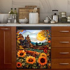 the kitchen counter has sunflowers painted on it