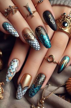 Channel your inner mermaid with these stunning nails! A mix of white, turquoise, red, black, and gold creates a look that’s both vibrant and magical. Iridescent Nail Polish, Orange Mermaid, Mermaid Nail Art, Ocean Magic, Yellow Mermaid, Sophisticated Manicure, Mermaid Nail