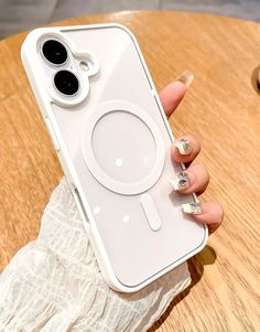 a woman's hand holding an iphone case that has a camera lens on it