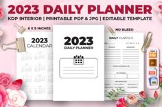 the daily planner is displayed on a pink background with flowers and clippings around it