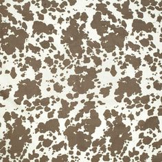 an animal print fabric with brown spots