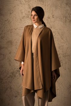 Paco Elegant Solid Poncho For Fall, Elegant Beige Cape Poncho, Elegant Cape Poncho For Work, Elegant Brown Merino Wool Outerwear, Elegant Winter Poncho For Layering, Elegant Fall Poncho Cape, Elegant Beige Poncho, Elegant Alpaca Outerwear For Winter, Elegant Alpaca Outerwear For Fall