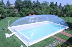 an inflatable swimming pool on the lawn