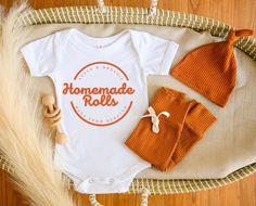 Homemade Rolls Onesie®. Super cute and trendy Thanksgiving outfit for newborns, infants, and toddlers. Buttery-soft cotton. Unisex design can be dressed up or down. Perfect for fall, pumpkin patch, and Thanksgiving pictures. Onesie® sizes are available in: 6m, 6-9m, 12m, 18m, 24m T-shirt sizes are available in: 12m, 18m, 2T, 3T, 4T Larger sizes may be available upon request Colors available: White with black text Natural with black text Natural with orange text White with black text White with o Homemade Rolls Onesie, These Rolls Are Homemade Onesie, Newborn First Thanksgiving, Thanksgiving Onesie Boy, Newborn Thanksgiving Outfit, Baby Thanksgiving Outfit, Thanksgiving Baby Onesie, Toddler Thanksgiving, Baby Thanksgiving