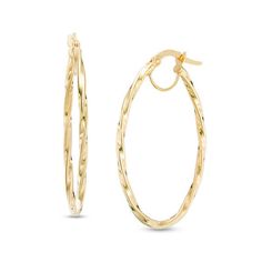 An unexpected twist on a classic look, these striking hoop earrings are quite enticing. Crafted in warm 14K gold, each 36.0 x 24.0mm oval-shaped hoop features a graceful twist for a style that's surprising yet pleasing. Polished to a bright shine, these earrings secure with hinged backs. Oval 14k Gold Hoop Earrings, Elegant 14k Gold Oval Hoop Earrings, 14k Gold Oval Hoop Earrings, Oval Gold Hoop Earrings With Diamond Cut, Gold Oval Diamond Cut Hoop Earrings, Gold Diamond Cut Oval Hoop Earrings, Formal 14k Gold Oval Hoop Earrings, Oval Diamond Cut Hoop Earrings For Formal Occasions, Elegant Oval Hypoallergenic Hoop Earrings