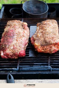 two steaks are cooking on the grill with some seasoning in front of them