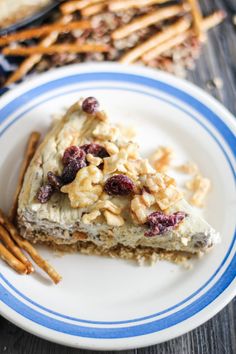 a piece of pie on a plate with cinnamon sticks