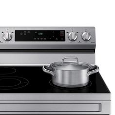 a stainless steel stove with a pot on the burner