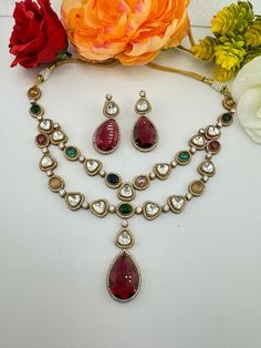 This is a gorgeous 2-layer Indo-western Premium quality moissanite Polki kundan with uncut kundan and American diamond (CZ) necklace set with multicolor stone and matching earrings and has an distinct shine and brightness. This goes well with Indian as well as western dresses. This is so beautiful to look at and a perfect one for Bridal wear and party wear. Color : gold, Multicolor Necklace length : 20-22 inches (Dori cloosure) Necklace width :  Earring length : 2.25 inch Earring width : 1 inch Necklace Set With Earrings, Multicolor Necklace, Premium Jewelry, Layered Necklace Set, Layer Necklace, Cz Necklace, Indo Western, Indian Weddings, Western Jewelry