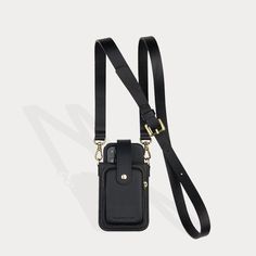 a black cell phone case hanging from a lanyard with a gold metal clip on it