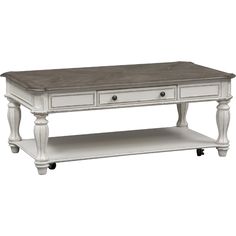 a white coffee table with two drawers on one side and an open shelf underneath it