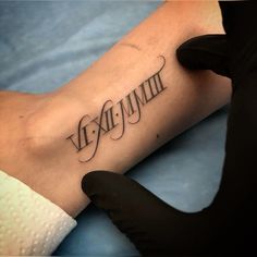 a person with a tattoo on their arm that reads, exemplimen