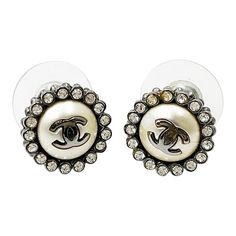 This is part of Chairish’s Costume Jewelry assortment.  Chanel Gunmetal CC Round Crystal Small Piercing Earrings  *Marked 16 *Made in France  -It's approximately 0.5" x 0.5". -Very beautiful and unique -In a good condition. There is a small peeling on one of the pearls.  1146-41596 Piercing Earrings, Types Of Girls, Classic Hollywood, Jewelry Earrings Studs, Costume Jewelry, Made In France, Piercings, Violet, Give It To Me