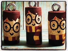 three harry potter canisters with glasses painted on them