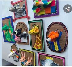 the wall is decorated with colorful pictures and animal heads