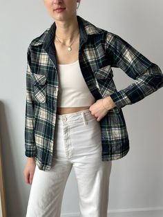 This vintage Woolrich plaid shirt jacket features a blue and green plaid pattern with ivory buttons, crafted from warm and durable wool. With a touch of elegance and a sense of history, this unique and special piece is perfect for adding vintage charm to your wardrobe or keeping cozy in cooler weather. Message me for measurements and I will send them to you. For reference, the model is a size 4/Small. This top fits more like an XS/S We do not accept returns but if there is an issue with your ord Green Flannel Shirt For Workwear And Fall, Classic Flannel Outerwear With Button Closure, Classic Button-up Flannel Outerwear, Classic Green Flannel Shirt For Fall, Classic Collared Flannel Outerwear, Green Flannel Shirt With Buttons For Fall, Green Flannel Shirt For Fall, Long Sleeve Wool Plaid Flannel Shirt, Wool Long Sleeve Flannel Shirt With Button Closure