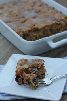 a piece of cake sitting on top of a white plate with a fork in it