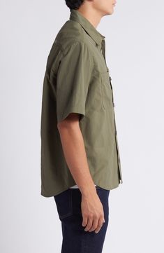 Lightweight, lightly rumpled nylon styled in a mossy green makes a warm-weather favorite of a shirt that looks best when you leave it untucked on sunny days. Front button closure Spread collar Short sleeves Chest patch pockets 100% nylon Machine wash, line dry Imported Khaki Collared Camp Shirt For Outdoors, Khaki Button-up Top For Outdoor, Khaki Outdoor Shirt With Button Closure, Solid Outdoor Shirt With Buttons, Solid Buttoned Shirt For Outdoor, Khaki Buttoned Tops For Outdoor, Military Style Short Sleeve Outdoor Shirt, Military Short Sleeve Outdoor Shirt, Military Short Sleeve Shirt For Outdoor