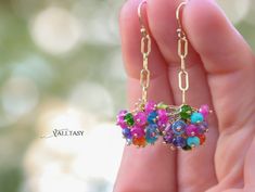 Colorful and cheerful like a confetti, these dangle earrings are just adorable! They’re made with exquisite, really gorgeous, natural, colorful gemstones, creating wonderful floating clusters. The gems dangle on a statement, paperclip gold filled chain that creates a modern look, full of movement and color splashes. You can decide on their length – from very [...] Colorful Gemstones, Red Spinel, Earrings Colorful, Amethyst Purple, Pink Amethyst, Swiss Blue Topaz, Chain Earrings, Gold Filled Chain, Purple Amethyst