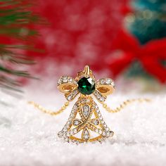 Jingle bells, jingle bells, jingle all the way. Get into the festive spirit with this delicate bell necklace! Super sweet these bells, don't ring - don't let them hear you coming we say! The pendant comes out with this fun idea, featuring a yellow gold tone bell with a sparkling green stone on the top, this masterpiece will bring you luck and happiness. Christmas is coming soon! Take this exquisite bell pendant to celebrate Christmas!Carat Weight: 0.4 ctStone Size: 4.5 mmStone Type: Jeulia® Ston Gold Bell Jewelry As A Gift, Gold Jewelry With Bells For Gift, Elegant Necklaces For Christmas Festive Occasions, Elegant Christmas Necklace For Festive Occasions, Elegant Necklaces For Christmas Festivities, Christmas Party Pendant Jewelry, Christmas Jingle Bells, Bell Necklace, Christmas Jingles