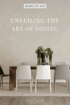 a dining room table with chairs and a vase on it, in front of a wall that says unveiling the art of dining