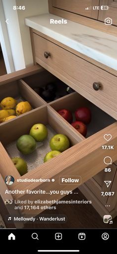 an open drawer with apples and other fruit in it's bottom compartment, labeled