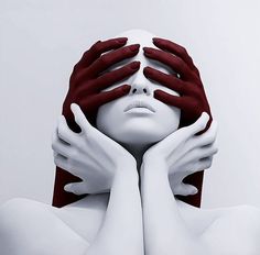 a woman with her hands covering her face