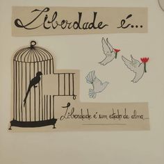 there is a sign with birds and a birdcage