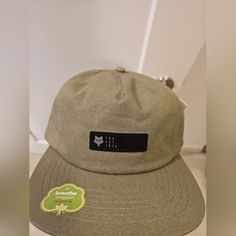 New With Tag. Adjustable Back. Urban Style Snapback Dad Hat For Outdoor, Khaki Casual Baseball Cap With Flat Bill, Flat Brim Snapback Hat For Camping, Casual Curved Brim Snapback Hat For Camping, Casual Snapback Baseball Cap For Camping, Urban Snapback Hat For Outdoor, Khaki Hat For Streetwear, One Size Fits Most, Casual Trucker Hat With Curved Brim For Camping, Casual Flat Bill Baseball Cap For Camping